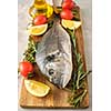 Fresh Raw Dorado with lemon, thyme, cherry and rosemary 