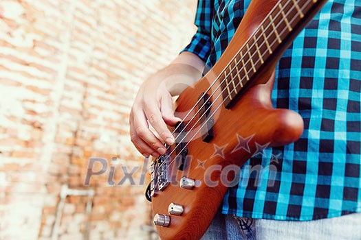 A street musician playing his guitar A street musician playing his guitar