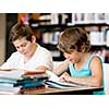 Two boys in library with books