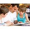 Father with sons in library with books