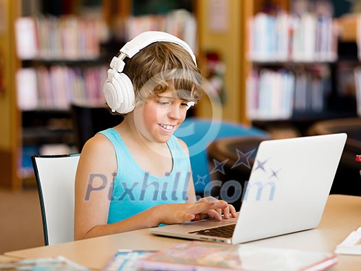 Boy spending time with notebook and modern technology Boy spending time with notebook and modern technology