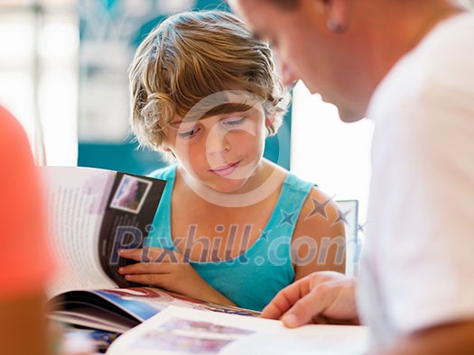 Family in library with books Family in library with books