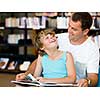 Father with son in library with books