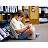 Boy in library with books