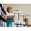 Boy in library choosing books