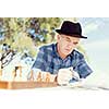 Senior gentleman reading newspaper in park