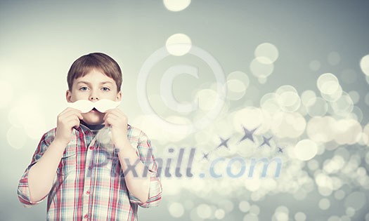 Cute boy wearing shirt and paper mustache Cute boy wearing shirt and paper mustache