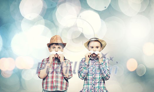 Cute girl and boy wearing shirt hat and mustache Cute girl and boy wearing shirt hat and mustache
