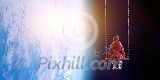 Cute kid girl sitting on swing high in sky Cute kid girl sitting on swing high in sky