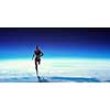Young athlete girl running high on clouds. Mixed media