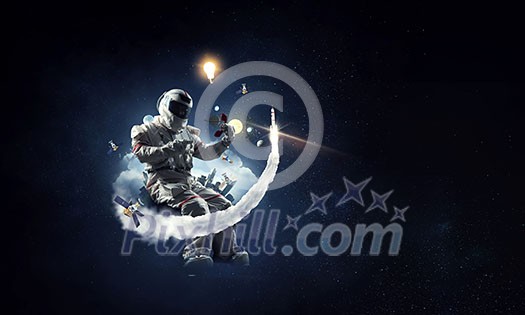 Astronaut man wearing suit in space. Mixed media Astronaut man wearing suit in space. Mixed media