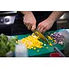 Chef hands cutting fresh and delicious vegetables for cooking or salad