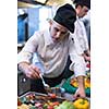 Chef finishing steak meat plate with Finally dish dressing and almost ready to serve at the table
