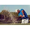 pro golf player shot ball from sand bunker at course