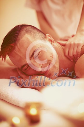 young handsome man have relaxing massage in spa and wellness salon young handsome man have relaxing massage in spa and wellness salon