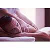 young handsome man have relaxing massage in spa and wellness salon