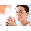 Attractive young woman with cup of tea or coffee at home