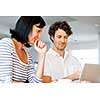 Happy modern couple surfing the net and working on laptop at home