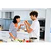 Couple cooking together in the modern kitchen at home