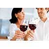 Portrait of a couple having a glass of red wine at home