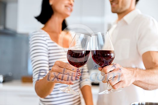 Portrait of a couple having a glass of red wine at home Portrait of a couple having a glass of red wine at home