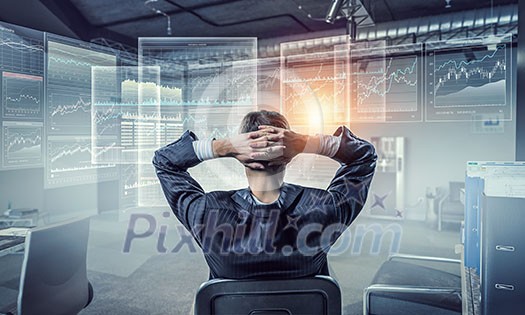 Relaxed businessman at the office sitting back with his hands behind his head Relaxed businessman at the office sitting back with his hands behind his head