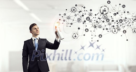 Concept of connection with businessman in office spraying social net concept from balloon Concept of connection with businessman in office spraying social net concept from balloon