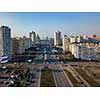 A bird's eye view from drone to the Darnyts'kyi district, Poznyaki of Kiev, Ukraine with modern buildings on a background of blue sky in the spring.