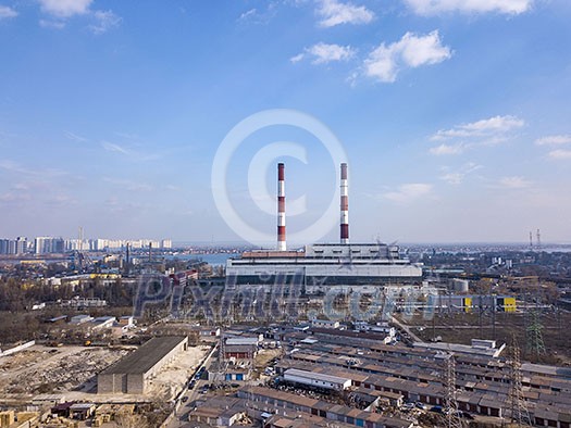 Panoramic view of Electric utility Company in an industrial zone on a background of clear blue sky. Aerial view from drone, city Kiev Ukraine. Panoramic view of Electric utility Company in an industrial zone on a background of clear blue sky. Aerial view from drone, city Kiev Ukraine.