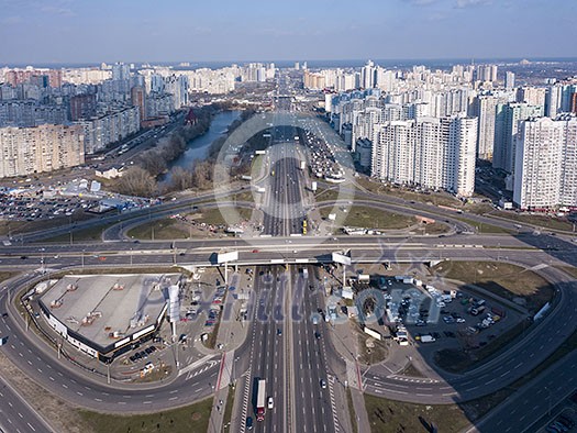 Aerial panoramic photography from the drone, bird's eye view to Pozniaky district, Mykoly Bazhana Ave with traffic and modern building of the city Kiev Ukraine at sunset . Aerial panoramic photography from the drone, bird's eye view to Pozniaky district, Mykoly Bazhana Ave with traffic and modern building of the city Kiev Ukraine at sunset .