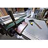 clamp and ruler tools on desk in factory for the production of wooden furniture