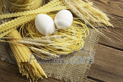 Close of spaghetti and eggs on table Close of spaghetti and eggs on table