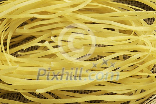 Close of dry spaghetti pasta on table Close of dry spaghetti pasta on table