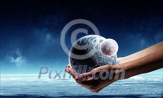 Earth planet in palm. Elements of this image are furnished by NASA Earth planet in palm. Elements of this image are furnished by NASA