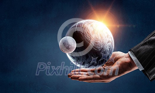 Earth planet in palm. Elements of this image are furnished by NASA Earth planet in palm. Elements of this image are furnished by NASA