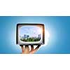 Old fashioned tube TV in human palm. Mixed media