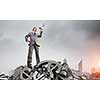 Low angle view of businessman looking like giant. Mixed media