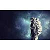 Spaceman wearing astronaut suit outdoor. Mixed media