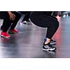group of young healthy sporty women working out with instructor doing aerobics exercises in a fitness studio fitness, sport, training, gym and lifestyle concept