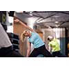 group of young healthy sporty women working out with instructor doing aerobics exercises in a fitness studio fitness, sport, training, gym and lifestyle concept