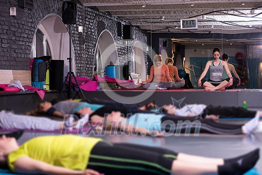 group of young healthy sporty women working out with instructor doing aerobics exercises in a fitness studio fitness, sport, training, gym and lifestyle concept group of young healthy sporty women working out with instructor doing aerobics exercises in a fitness studio fitness, sport, training, gym and lifestyle concept