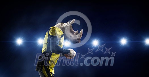 American football player with rhino animal head. Mixed media American football player with rhino animal head. Mixed media