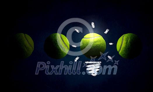 Light bulb and big tennis ball as sign for creativity