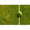 Big tennis ball on line of field