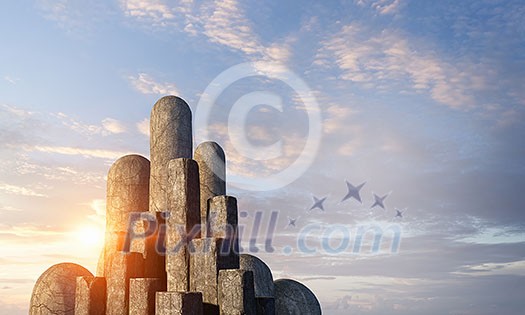 Stone gray bars of different size standing in ascending. Mixed media Stone gray bars of different size standing in ascending. Mixed media