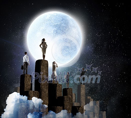 Tean of businesspeople on top of stone column. Mixed media Tean of businesspeople on top of stone column. Mixed media