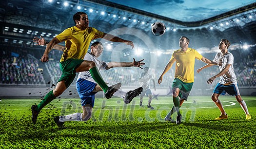 Soccer players at sport stadium fighting for ball . Mixed media Soccer players at sport stadium fighting for ball . Mixed media