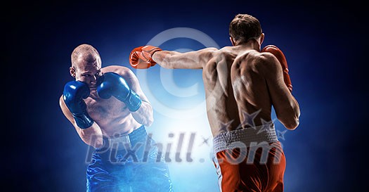 Two boxers fighting in lights of arena. Mixed media Two boxers fighting in lights of arena. Mixed media