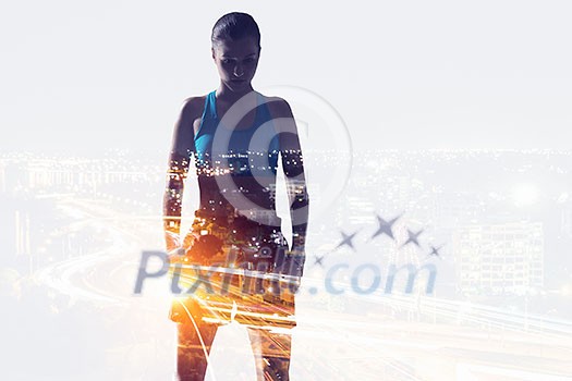 Double exposure of boxer woman and modern cityscape. Mixed media Double exposure of boxer woman and modern cityscape. Mixed media