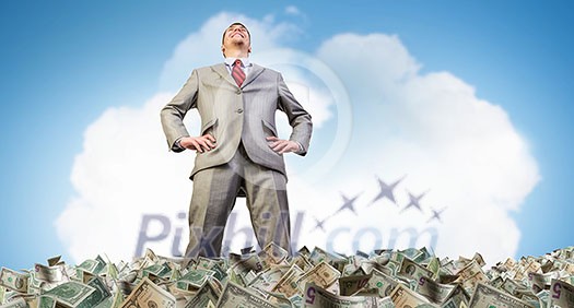 Rich businessman in pile of money banknotes Rich businessman in pile of money banknotes